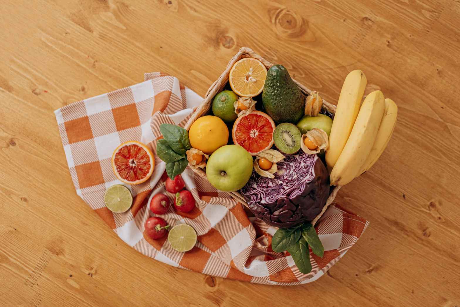 assorted fruits on brown wooden basket